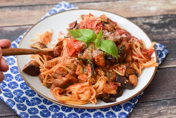 low fodmap pasta alla norma on a plate with a spoon in it
