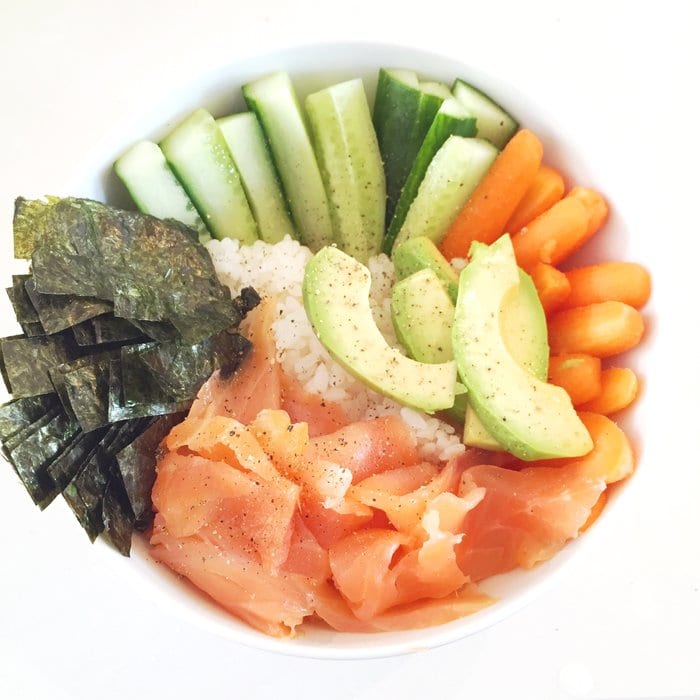A low FODMAP poke bowl with carrots, cucumber, nori, avocado and smoked salmon
