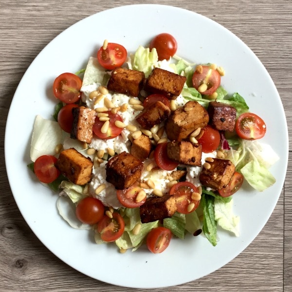 A tofu salad with tomatoes and cottage cheese