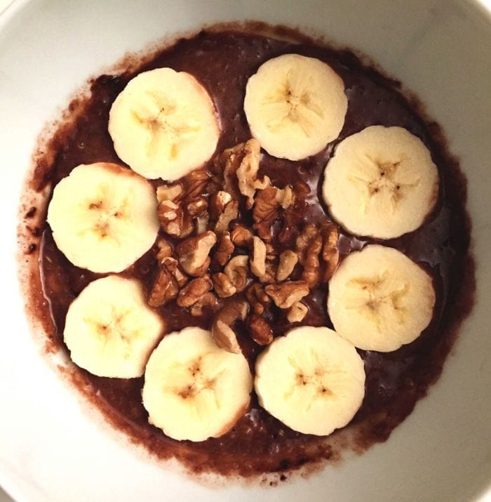 Low FODMAP chocolate quinoa porridge with banana in a bowl