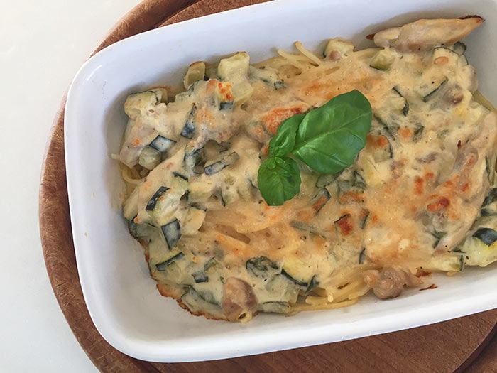 A low FODMAP baked pasta with cream sauce, zucchini and mushrooms