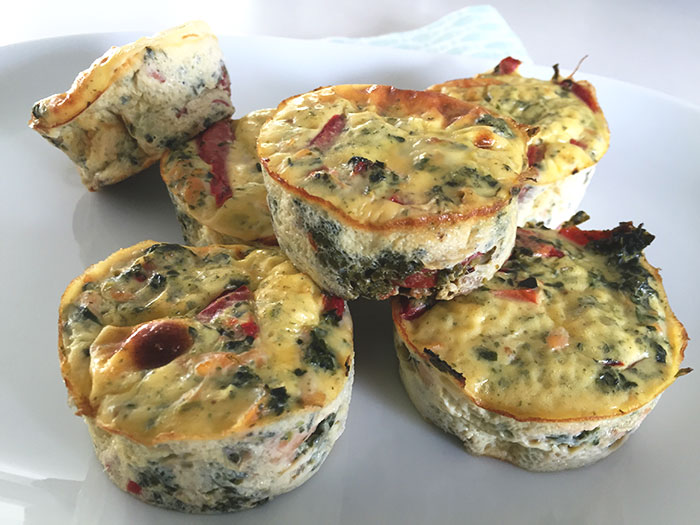Six low FODMAP egg muffins with salmon on a plate