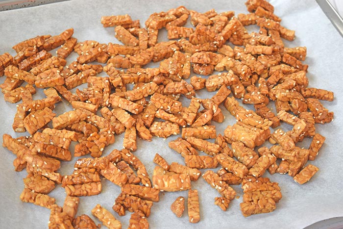 Crunchy sesame tempeh on a baking sheet