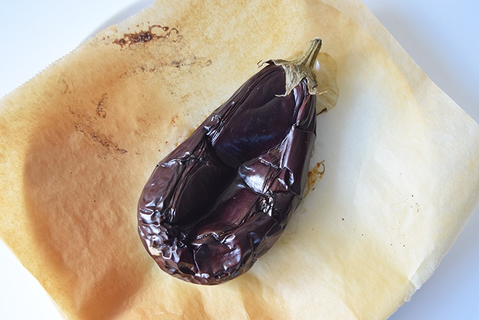 A grilled eggplant on a plate