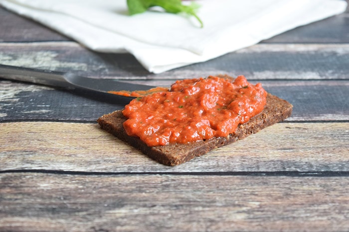 low fodmap roasted red pepper dip on a bread
