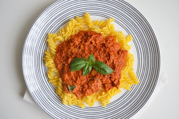 Pasta muhammara on a plate with stripes