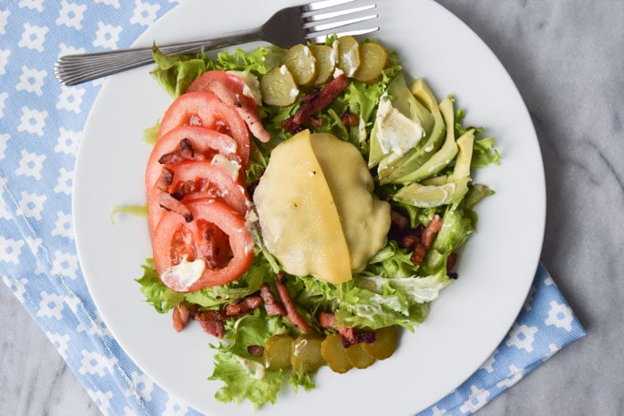 A low FODMAP burger salad on a plate photographed from above