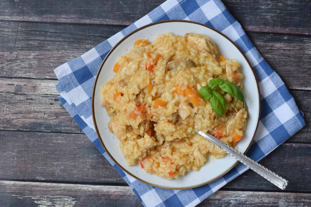 low fodmap chicken risotto on a plate with a napkin below