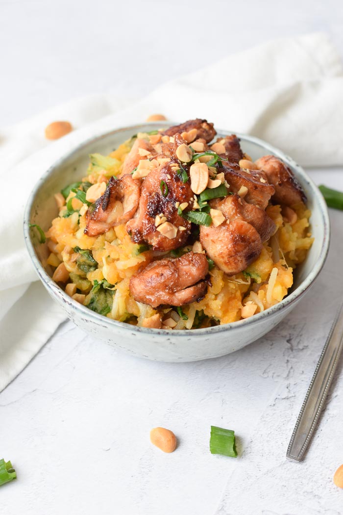 low FODMAP Asian-style potato mash in a bowl with chicken and peanuts