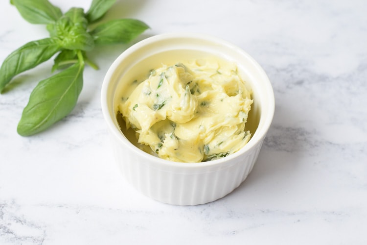 Low FODMAP herb butter with basilicum next to it