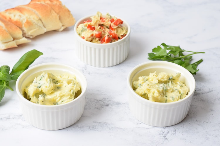 3 kinds of herb butter in bowls