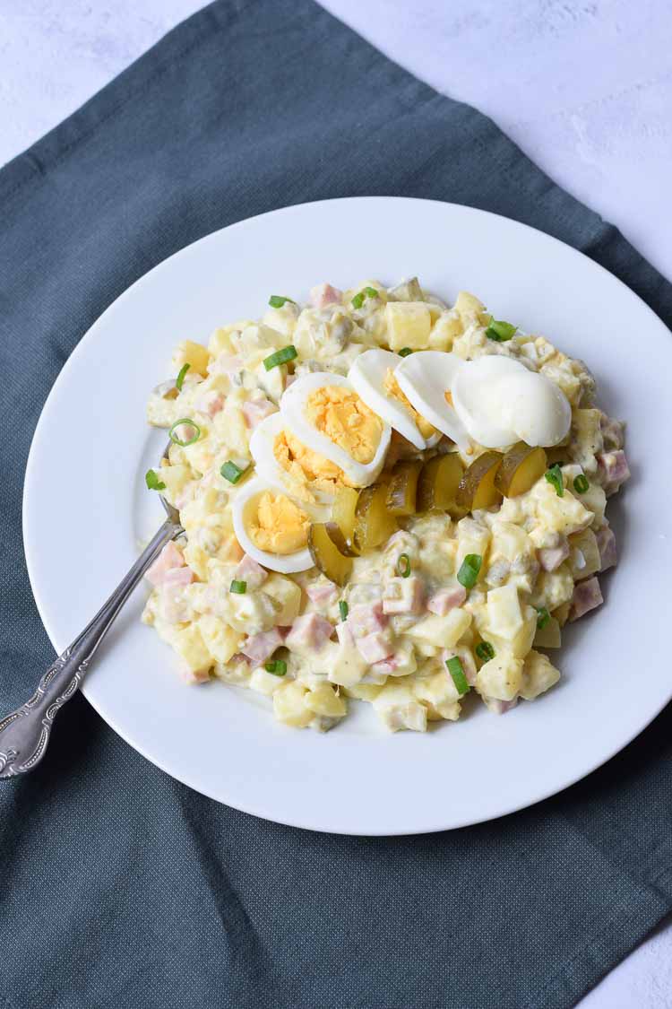 Low FODMAP potato salad on a white plate