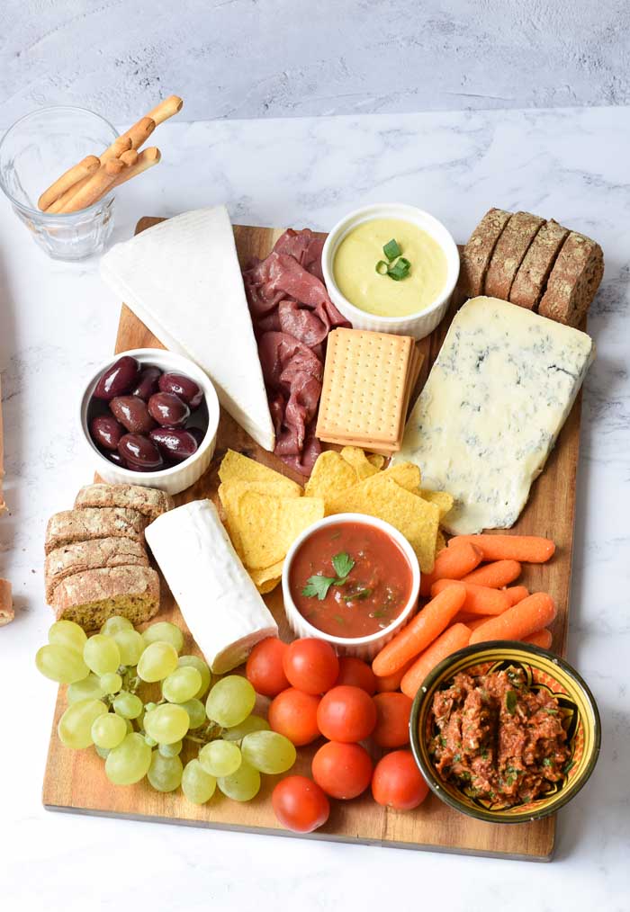 A low FODMAP snack platter with cheese, dips, vegetables and fruit