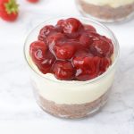 A low FODMAP mini strawberry cheesecake with a topping of pie filling