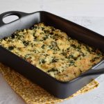 An oven dish with low FODMAP salmon and spinach lasagna