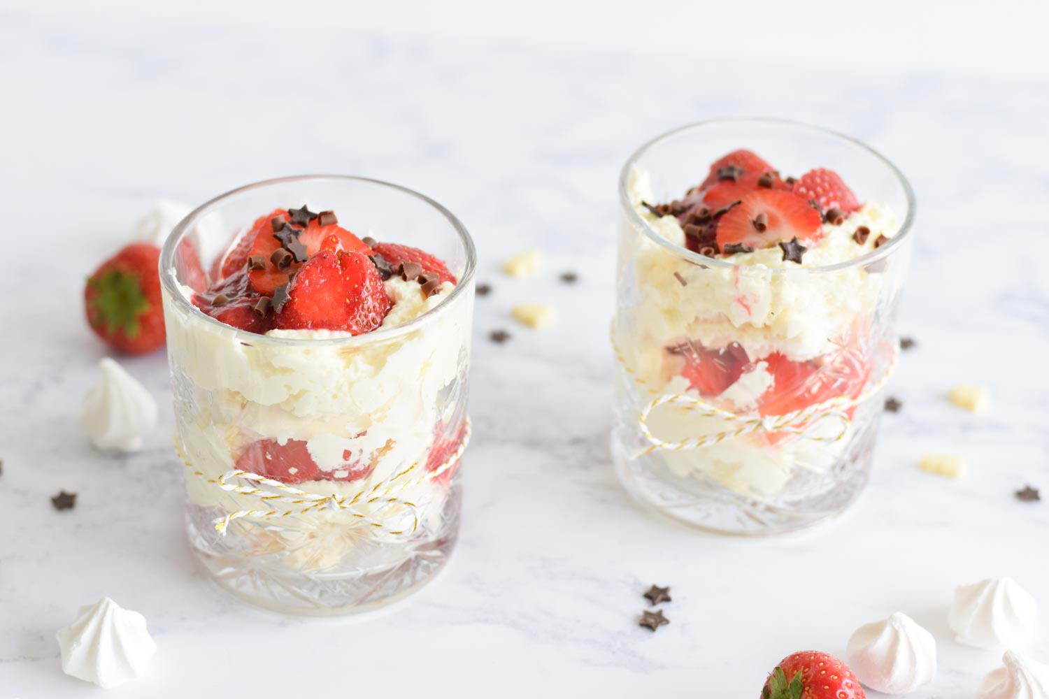 Two low FODMAP eton mess desserts in a glasses