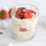 A glass of low FODMAP eton mess with strawberries