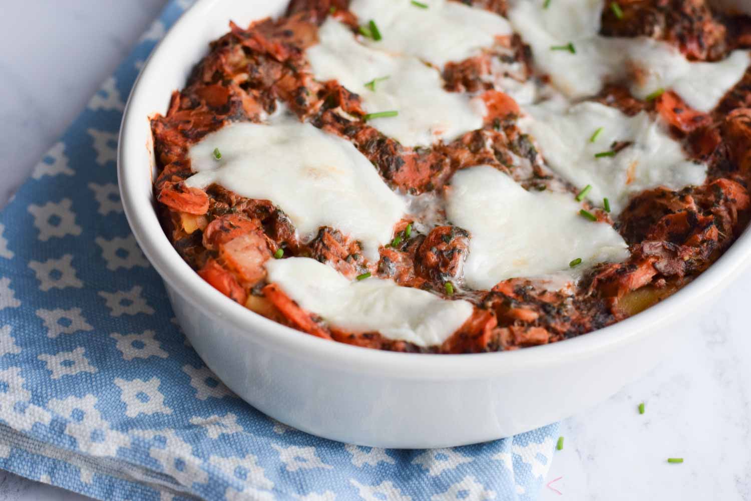 low FODMAP tuna lasagna in an oven dish with mozzarella on top