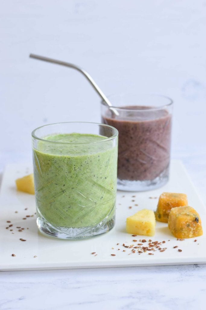 A green low FODMAP smoothie and another smoothie behind it