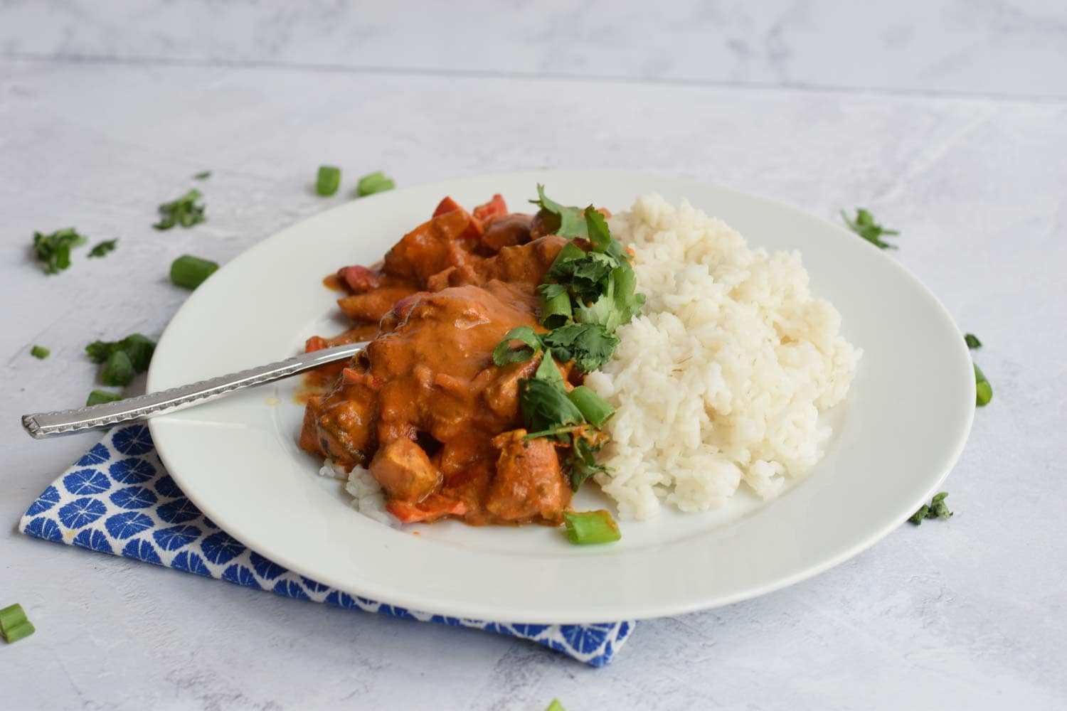 Low FODMAP chicken tikka masala with rice on a plate