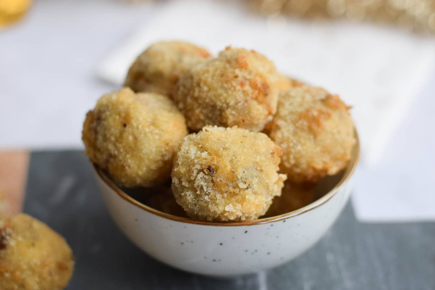 A bowl with low FODMAP mushroom croquettes
