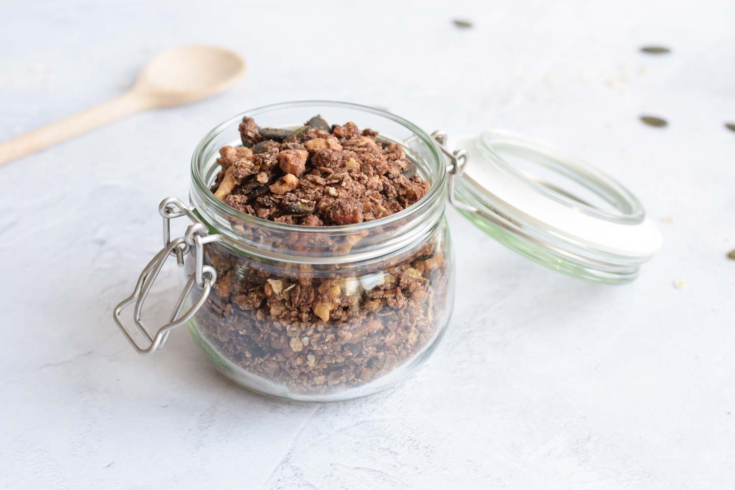 A jar with gluten-free chocolate buckwheat granola