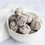 A bowl of low FODMAP healthy chocolate coconut balls