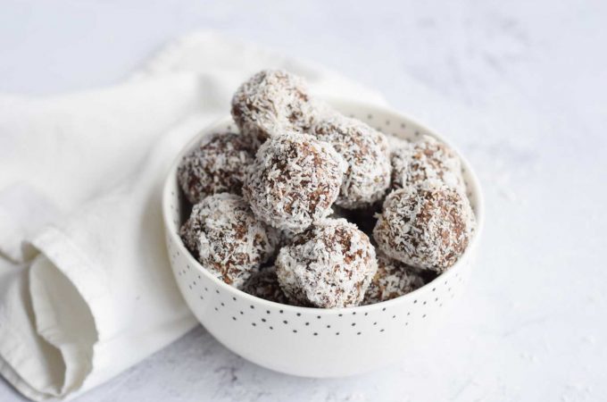 A bowl of low FODMAP healthy chocolate coconut balls