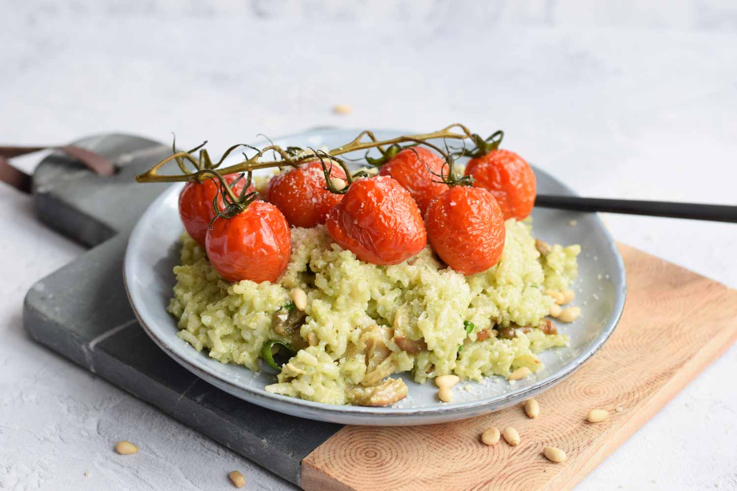 A plate with risotto and grilled tomatoes