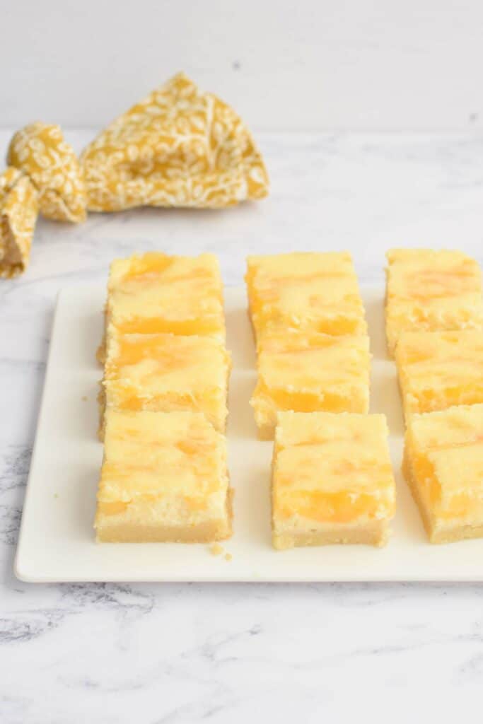 Gluten-free lemon cheesecake bars on a plate