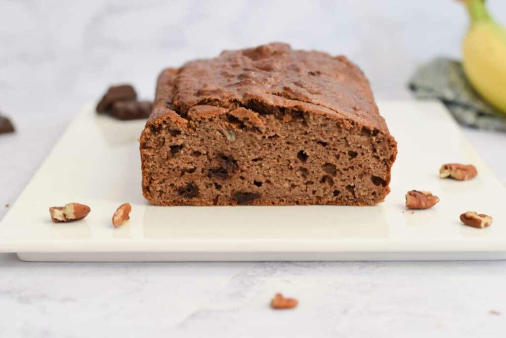 A chocolate coffee banana bread photographed from the side
