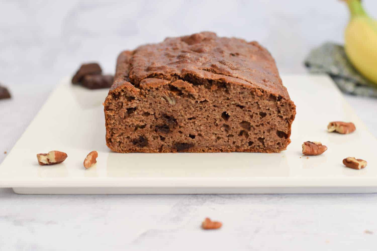 A chocolate coffee banana bread photographed from the side