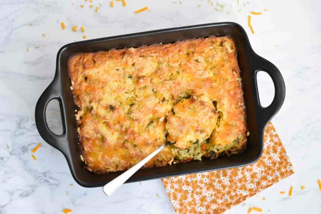 A low FODMAP broccoli rice casserole made from scratch in a black oven dish