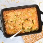 A low FODMAP broccoli rice casserole made from scratch in a black oven dish