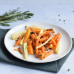 A plate with low FODMAP oven roasted carrot, parsnip and sweet potato