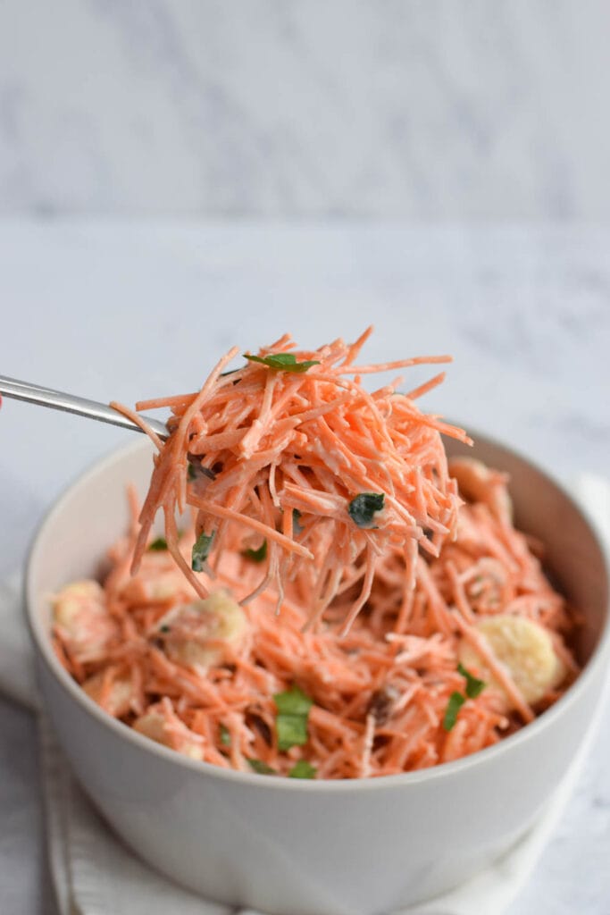 Low FODMAP carrot salad on a spoon