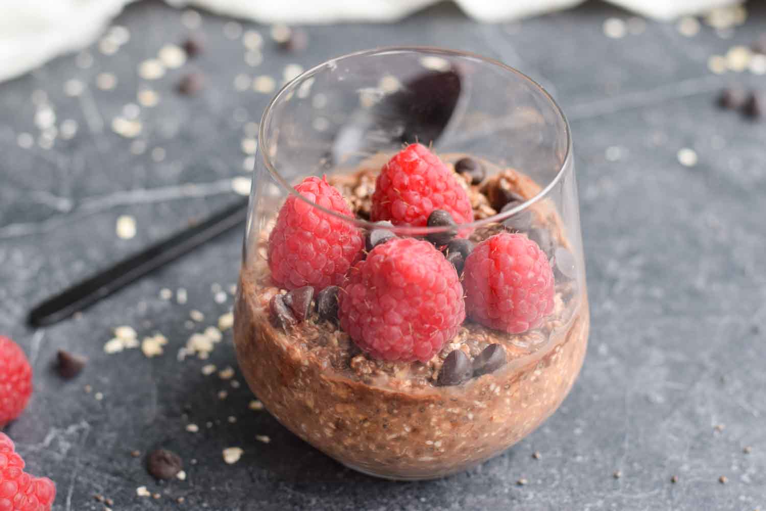 Overnight oats in a glass with raspberries