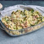 A low FODMAP chicken broccoli rice casserole with grated cheese on top
