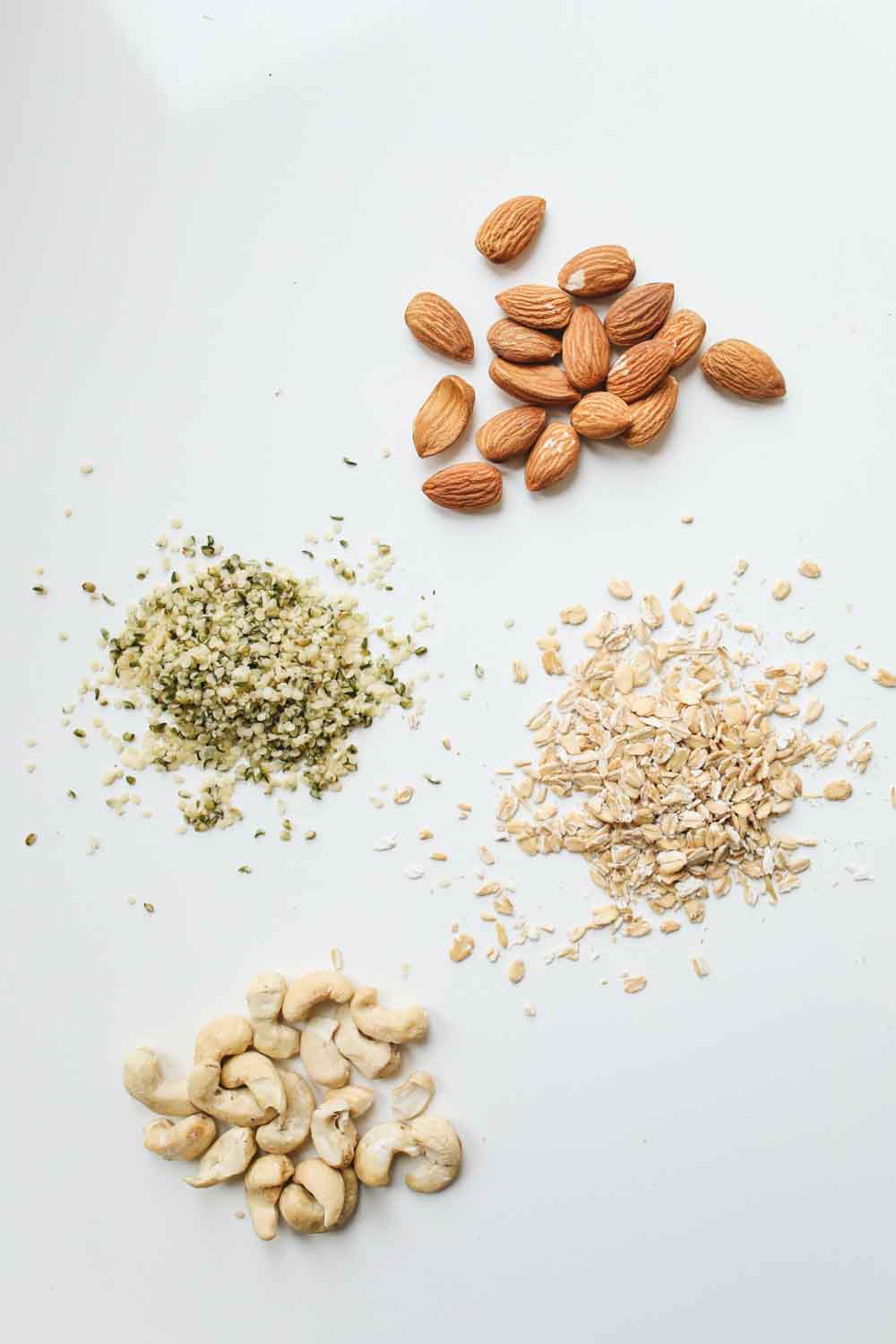 Different nuts and seeds on a white background