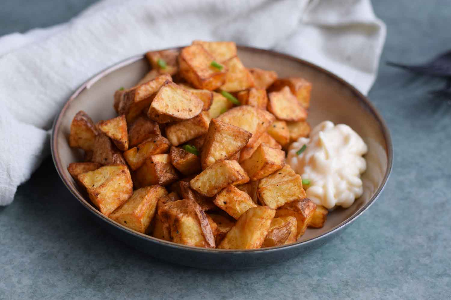 A plate with crispy roasted potatoes from the oven