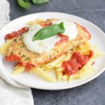 Low FODMAP chicken parmesan with pasta on a plate