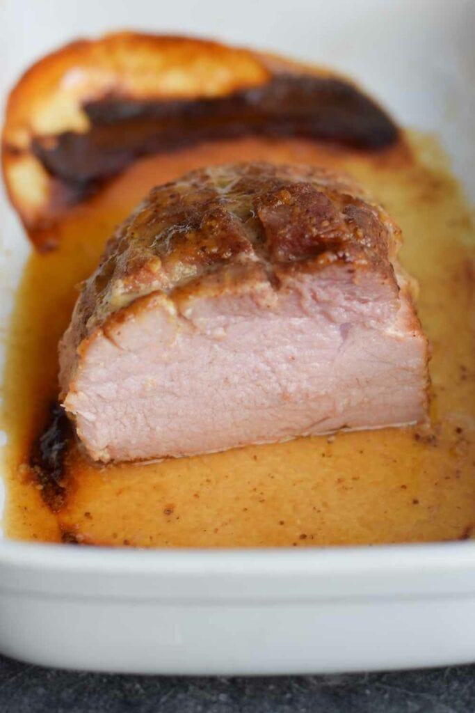 A low FODMAP maple mustard glazed ham in a dish