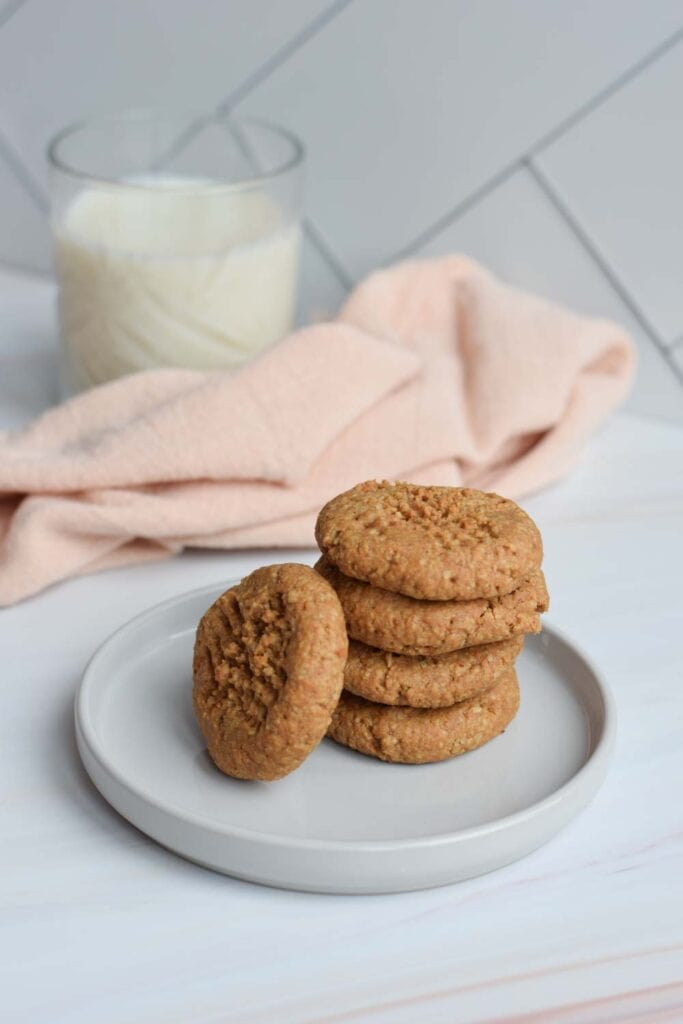 A stack of low FODMAP peanut butter cookies on a plate